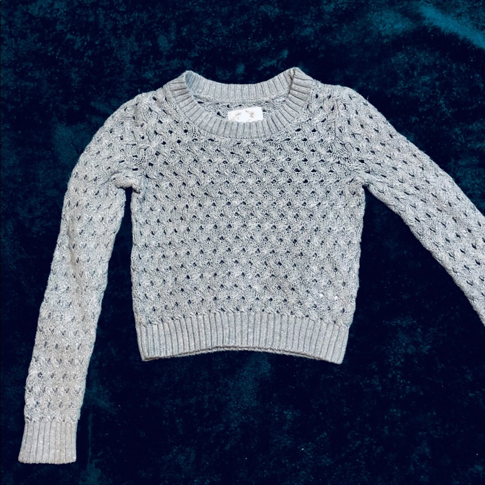 Justice silver sweater.    Kids Size12